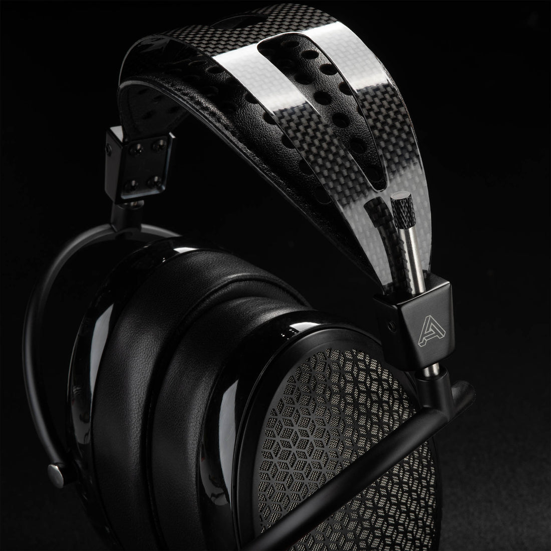 Audeze CRBN electrostatic headphone highlighting carbon fiber headband