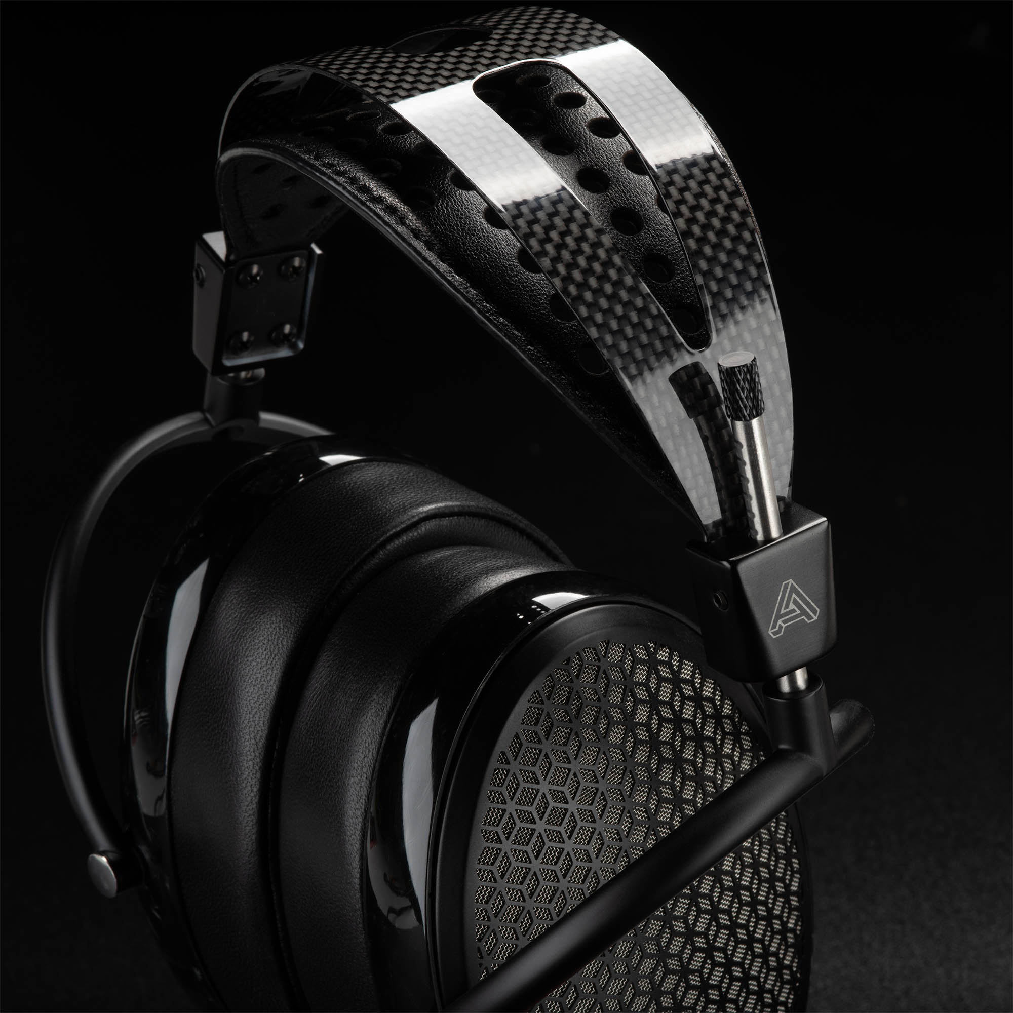 Audeze CRBN electrostatic headphone highlighting carbon fiber headband