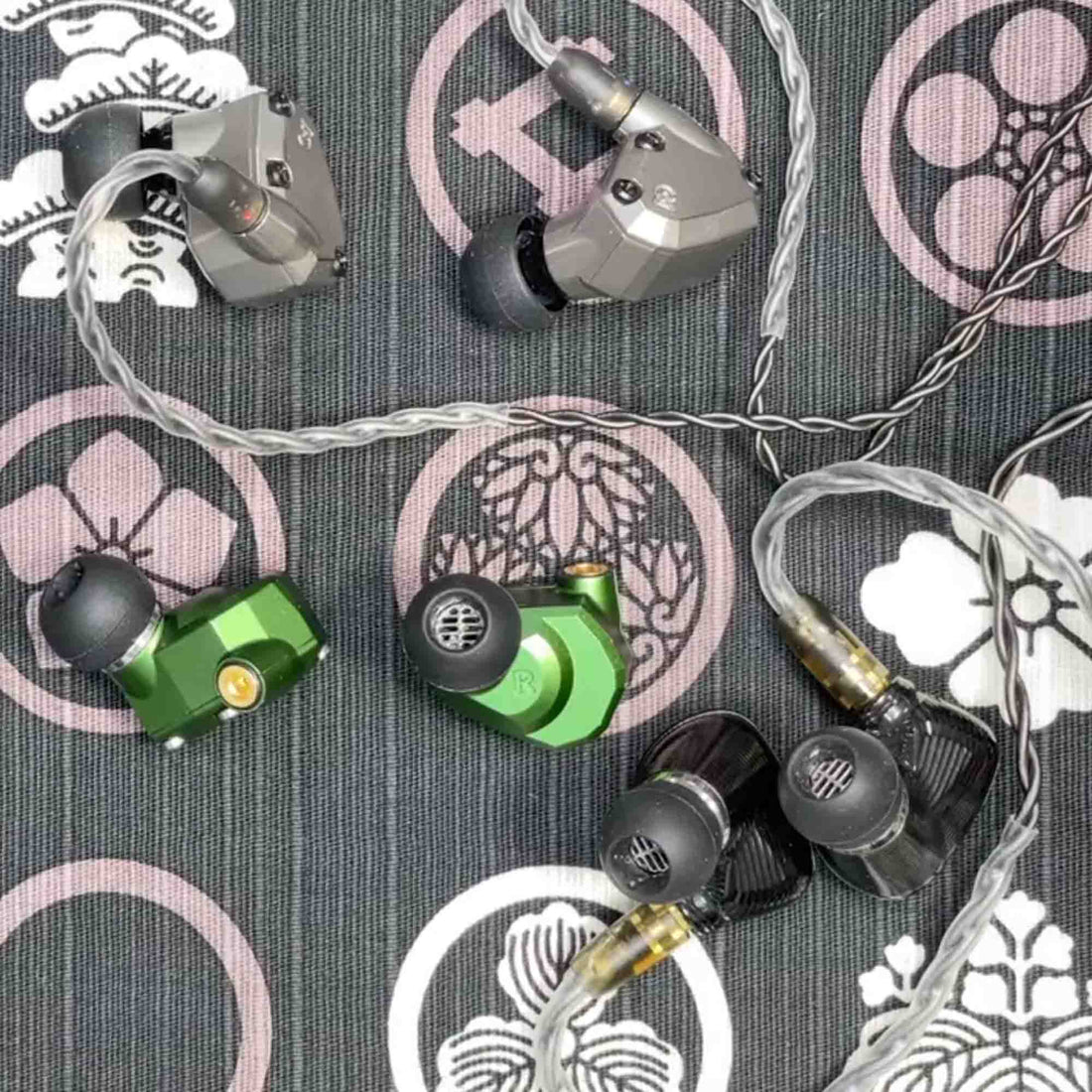 Campfire Ara, Andromeda, and Solaris 2020 in ear monitors on pastel tablecloth
