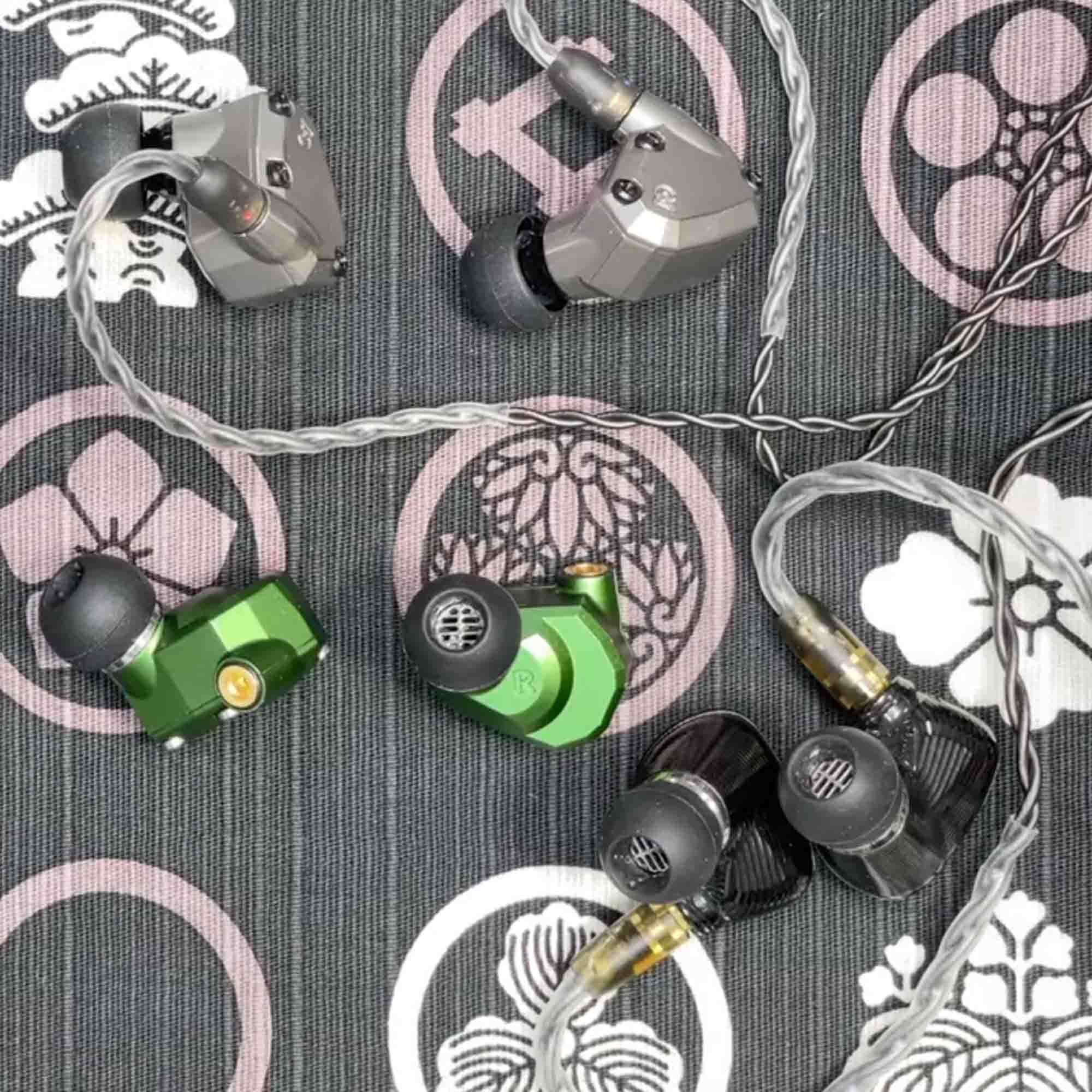 Campfire Ara, Andromeda, and Solaris 2020 in ear monitors on pastel tablecloth