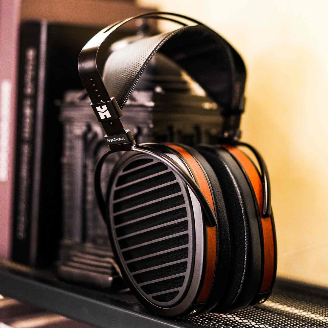 HIFIMAN Arya Organic headphone leaning against bookshelf