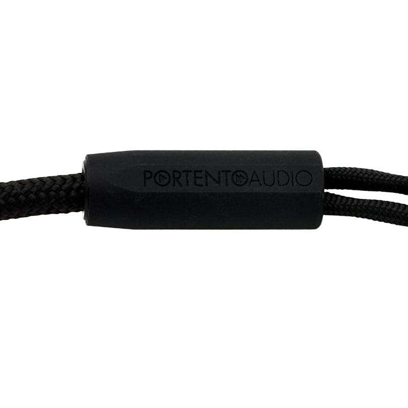 Close-up of black rubber housing with Portento Audio logo on the Portento Audio Melodia Premium Upgrade Headphone Cable on white background