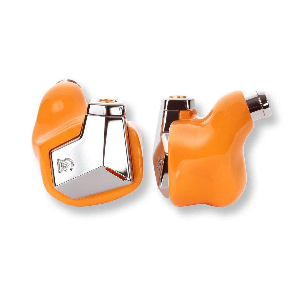 Close-up of Campfire Supermoon in ear monitors with bright orange shells and polished metal accents on white background