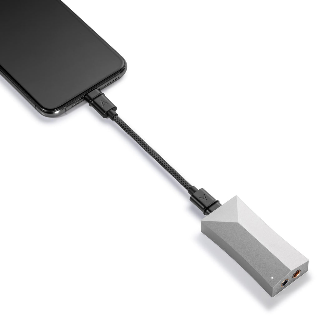 Astell&Kern AK HC4 Hi-Fi USB DAC connected to a smartphone with a black braided cable on white background