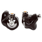 Close-up of Campfire Cascara in ear monitors with glossy black 3D printed shells and metal accents on white background