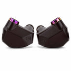 Close-up of black Campfire Fathom in ear monitors with purple accents and geometric design on white background