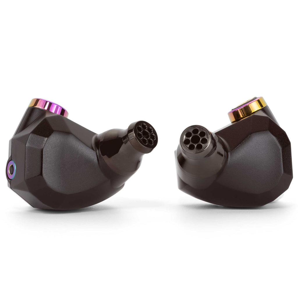 Close-up of Campfire Fathom in ear monitors showing black housing with multitone metallic accents on white background