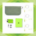 Flat lay of Campfire Ponderosa earphones with gray carrying case, lime green cloth, cleaning brush, and ear tips on white background