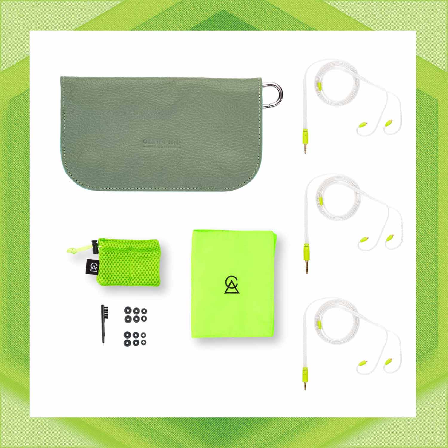 Flat lay of Campfire Ponderosa earphones with gray carrying case, lime green cloth, cleaning brush, and ear tips on white background