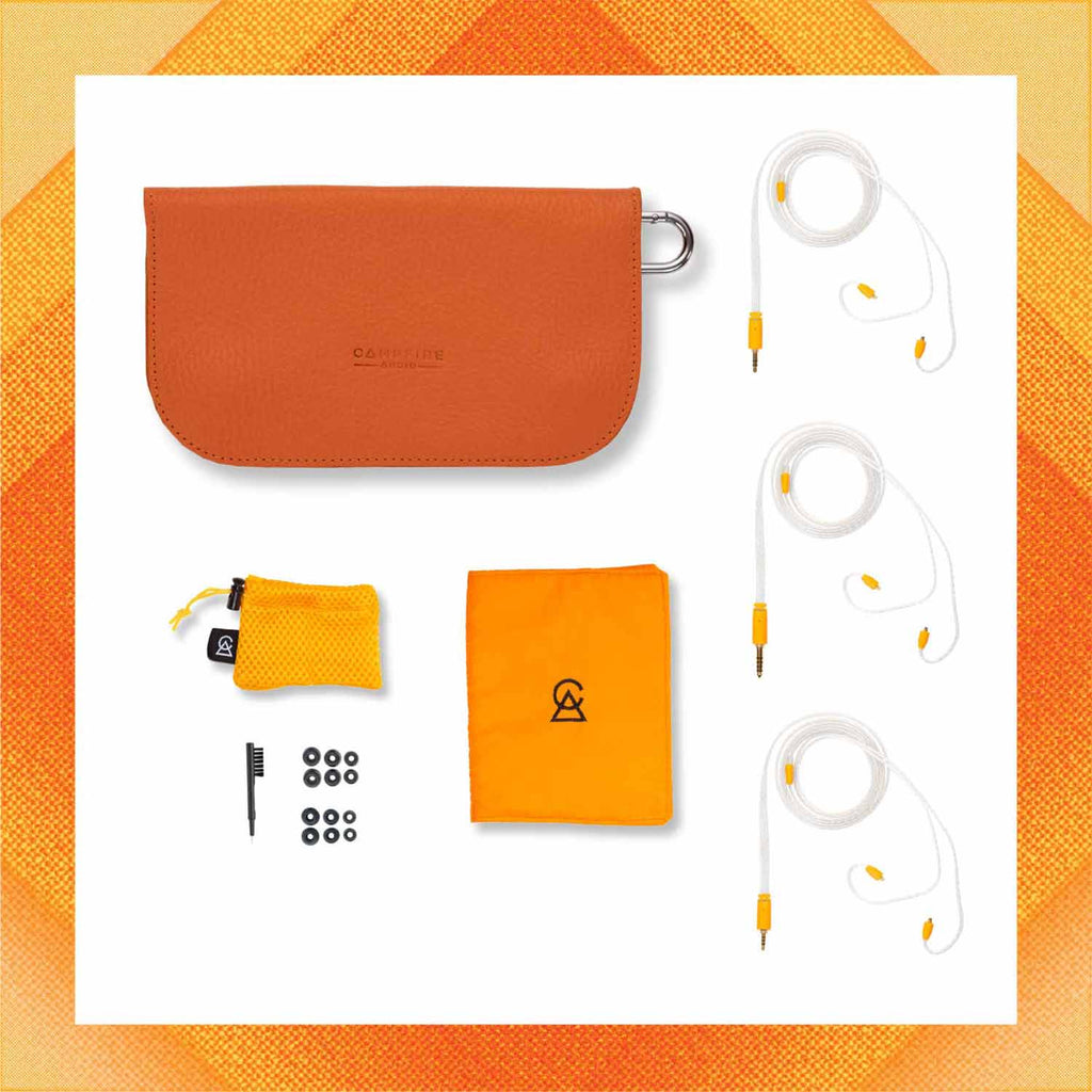Accessory kit for Campfire Supermoon including brown leather case, two yellow pouches, cleaning tool, ear tips, and three cable sets