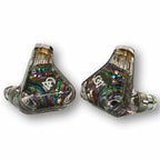 Pair of Campfire Trifecta 'Dark Prism' - Flagship IEM with transparent casing and colorful internal components on white background