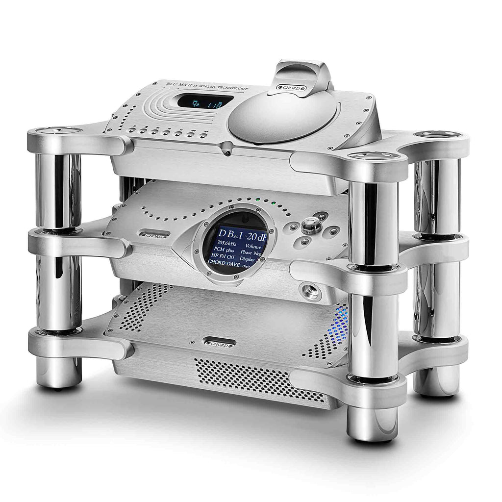 Silver Chord Ensemble Stand System holding stacked audio components with cylindrical supports on a white background