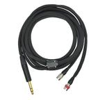 Dan Clark Audio VIVO Premium Headphone Cable coiled with gold 1/4 inch plug and multiple connectors on white background
