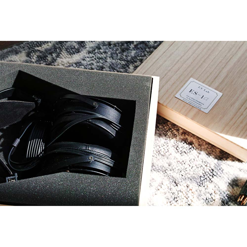 Black ES Lab ES-1 alpha (ES-1𝛼) 90mm Open Back Electrostatic Headphone nestled in foam packaging with wooden box nearby