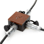 Ferrum Power Splitter for Ferrum Cables (Includes FPL 0.5m) with metal connectors and brown top panel on white background