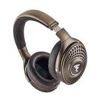 Focal Bathys MG Wireless Noise-Cancelling Headphones in metallic bronze with perforated ear cups and padded headband on white background