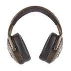 Focal Bathys MG Wireless Noise-Cancelling Headphones in brown with plush ear pads and perforated ear cups on white background