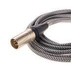 Close-up of the Focal Clear Balanced XLR Cable with braided black and white sleeve and metal connector on white background