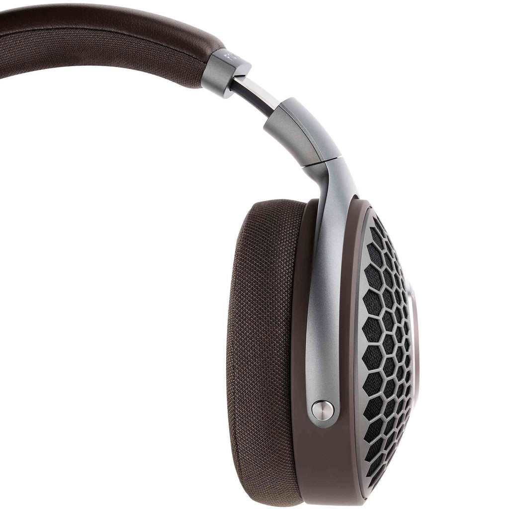 Side view of Focal Hadenys Open-Back Dynamic Headphones with brown ear pads and silver frame on white background