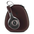 Focal Hadenys Open-Back Dynamic Headphones with honeycomb grille resting on a branded carrying case with zipper closure