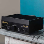 HeadAmp CFA3 Headphone Amp (Pre-Order Deposit) in black with control knobs and connected cables on a stone surface
