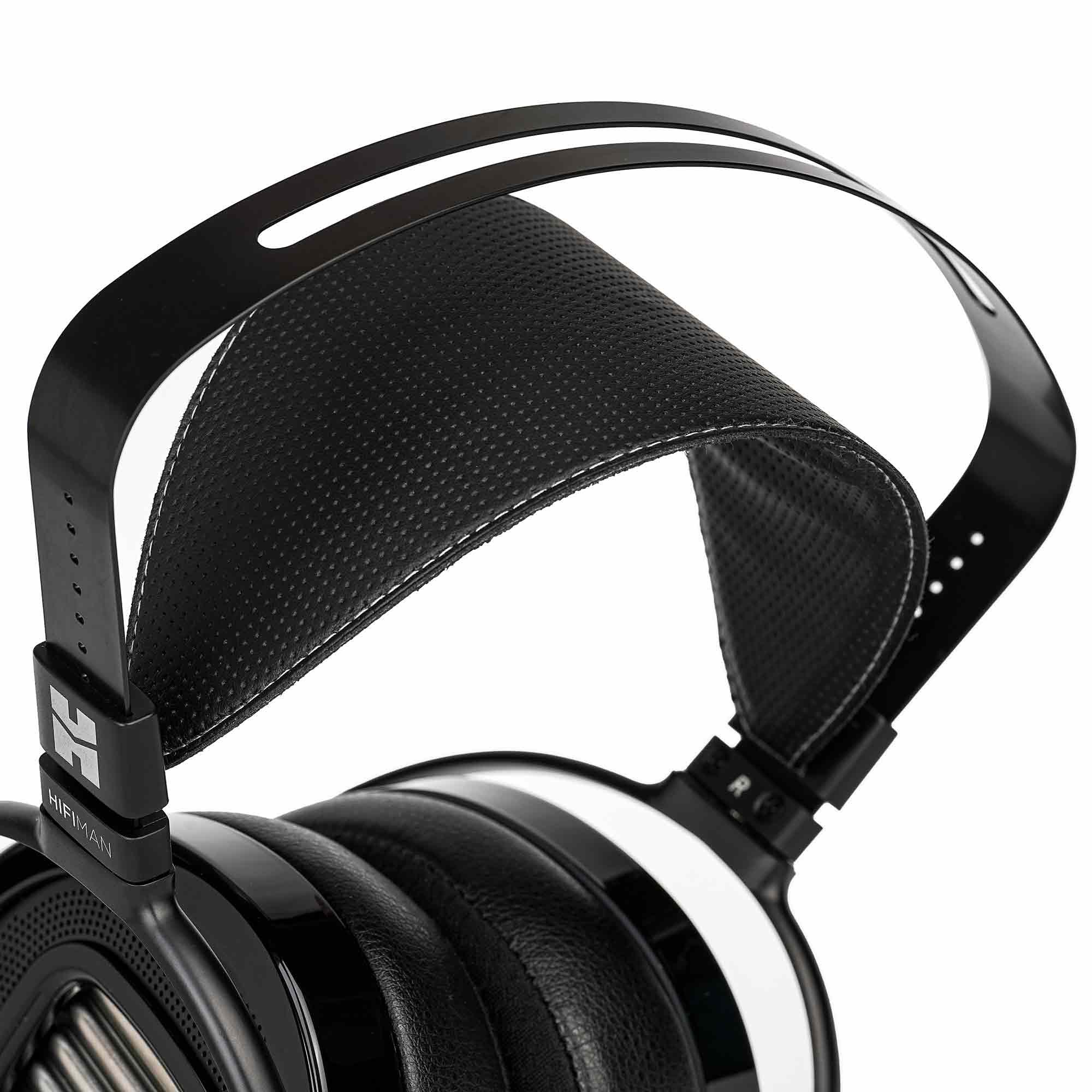 Close-up view of HIFIMAN Arya Unveiled Open-Back Planar Headphones showing headband and leather ear pads