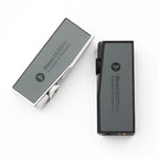 Two iBasso DC07PRO USB DAC/Amps in silver and black with volume knobs on a white background