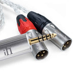 Close-up of iFi Audio 4.4mm to XLR Balanced Cable with gold-plated 4.4mm connector and two XLR balanced plugs