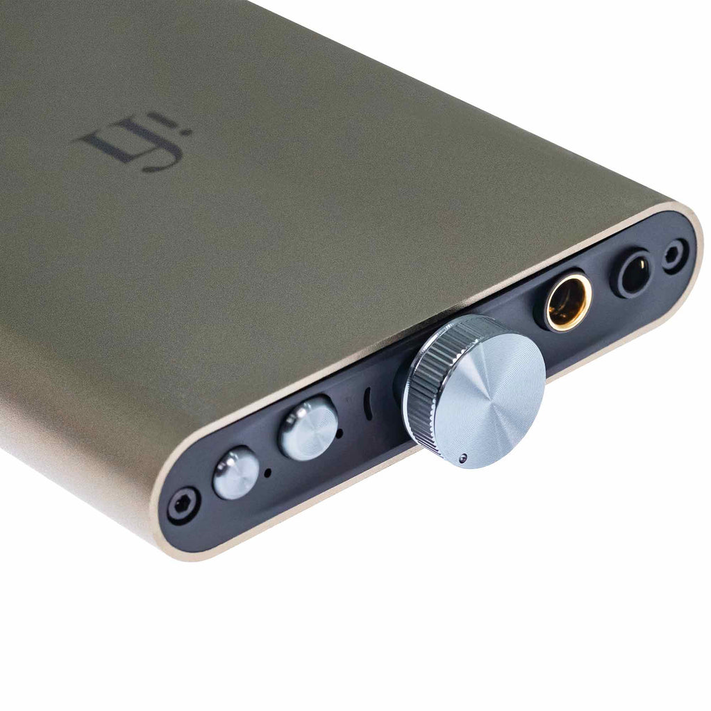 Close-up of the iFi Audio hip-dac3 Portable USB DAC/Amp with volume knob and headphone jacks in titanium shadow finish