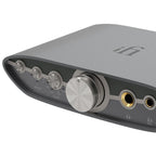 Close-up of iFi Audio ZEN CAN 3 Balanced Headphone Amp with control knobs and headphone jacks on gray casing