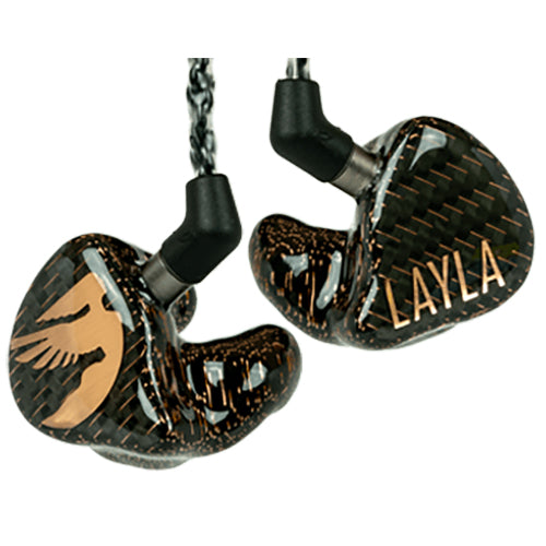 Close-up of Jerry Harvey Layla in ear monitors with carbon fiber housing and gold logo on white background