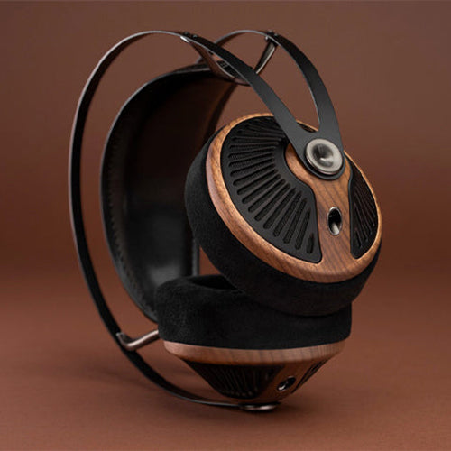 Meze 105 SILVA Dynamic Open-Back Headphones with wooden ear cups and black padded headband on a brown background