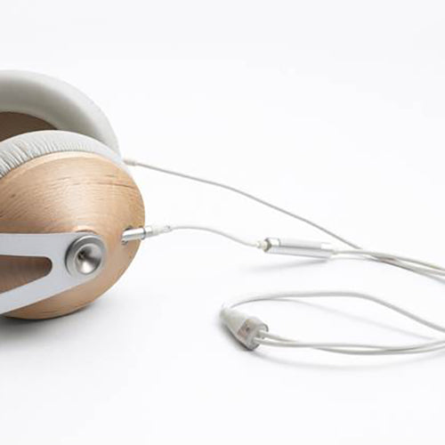 Meze 99 Series Headphone Cable connected to wooden earcup headphones with white ear pads on white background