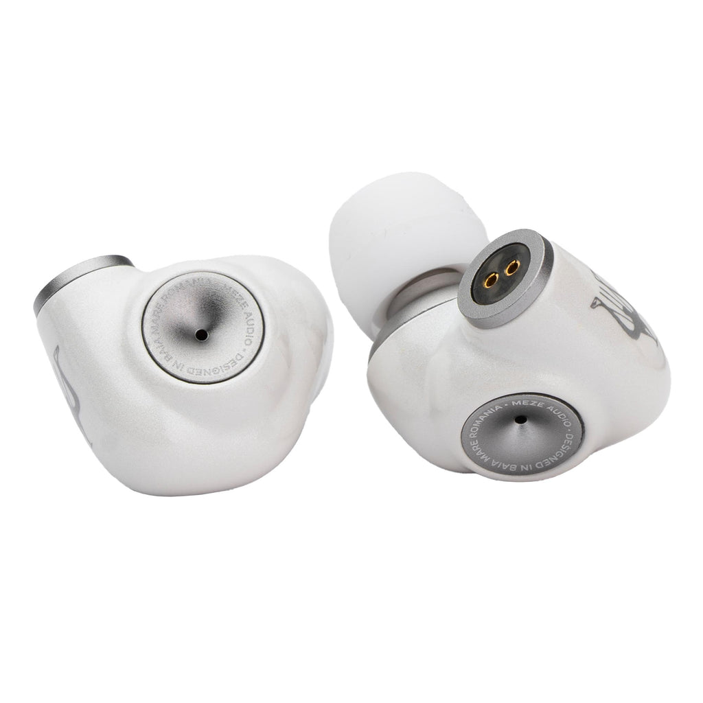 Close-up of silver Meze ALBA In-Ear Monitors showing nozzles and connector pins on white background