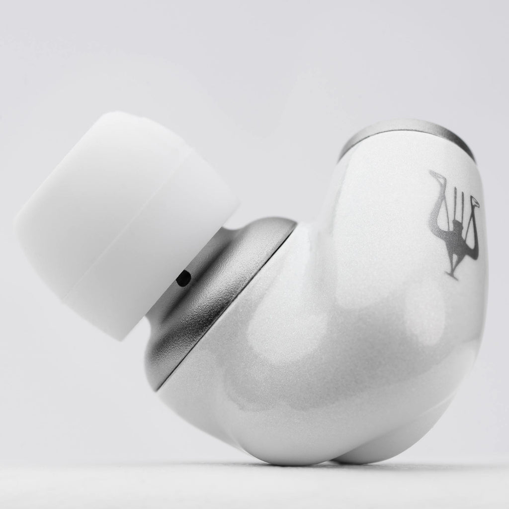 Close-up of a single white and silver Meze ALBA In-Ear Monitor earbud showing logo and silicone ear tip on white background