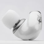 Close-up of a single white and silver Meze ALBA In-Ear Monitor earbud showing logo and silicone ear tip on white background