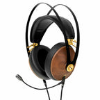 Meze Boom Mic attached to wooden ear cup headphones with black padded headband and gold accents on white background