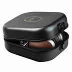 Meze POET Open-Back Planar Headphone partially visible inside a sleek black protective carrying case with logo on lid