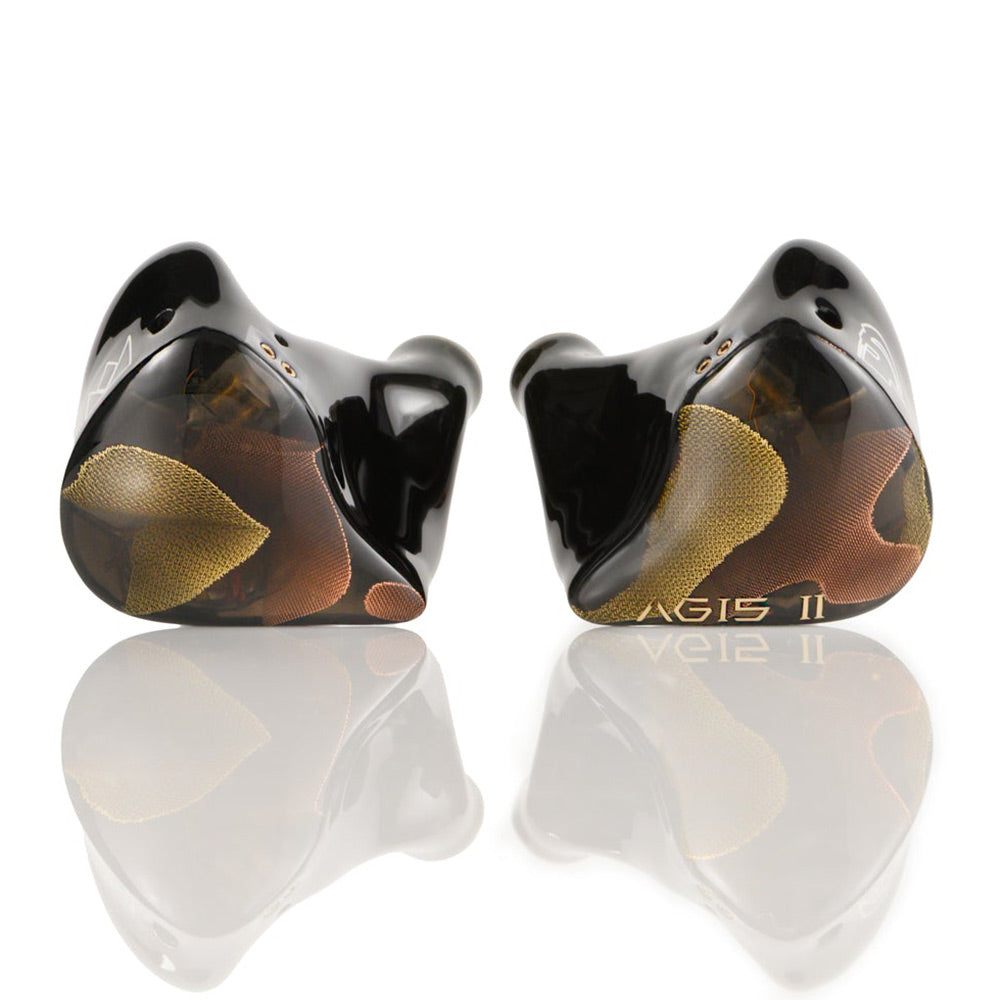 Noble Audio Agis II IEM with custom black and gold faceplates shown reflecting on a white surface