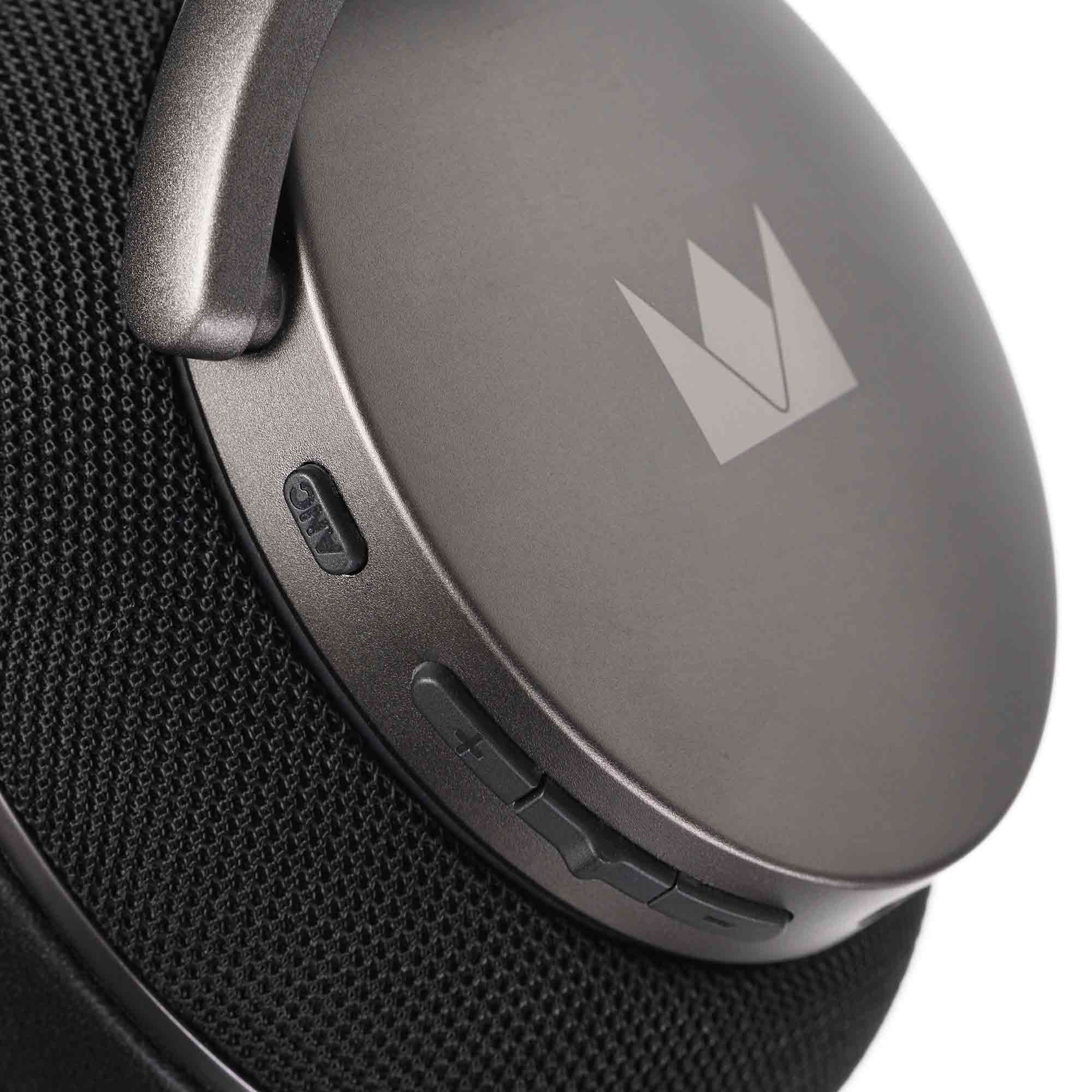 Close-up of the Noble Audio FoKus Apollo Wireless Headphones ear cup with control buttons and logo on a dark background