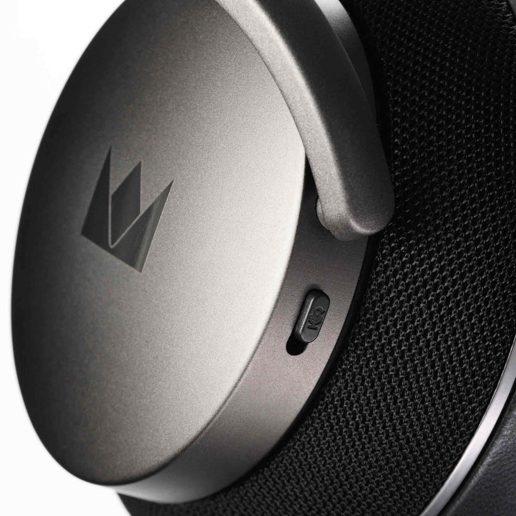 Close-up of the left ear cup on Noble Audio FoKus Apollo Wireless Headphones showing matte finish and ANC switch