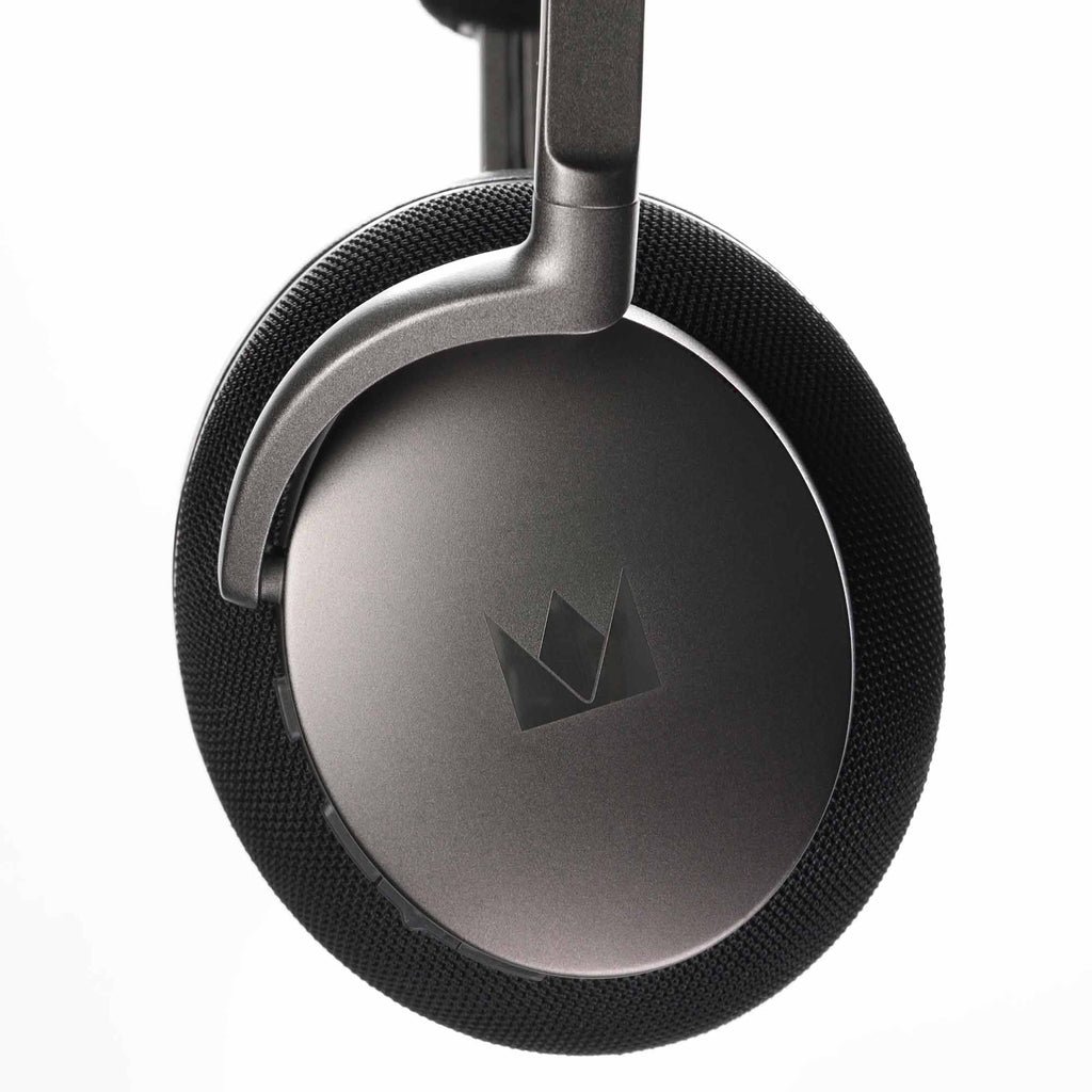 Close-up of the ear cup and headband of Noble Audio FoKus Apollo Wireless Headphones against a white background
