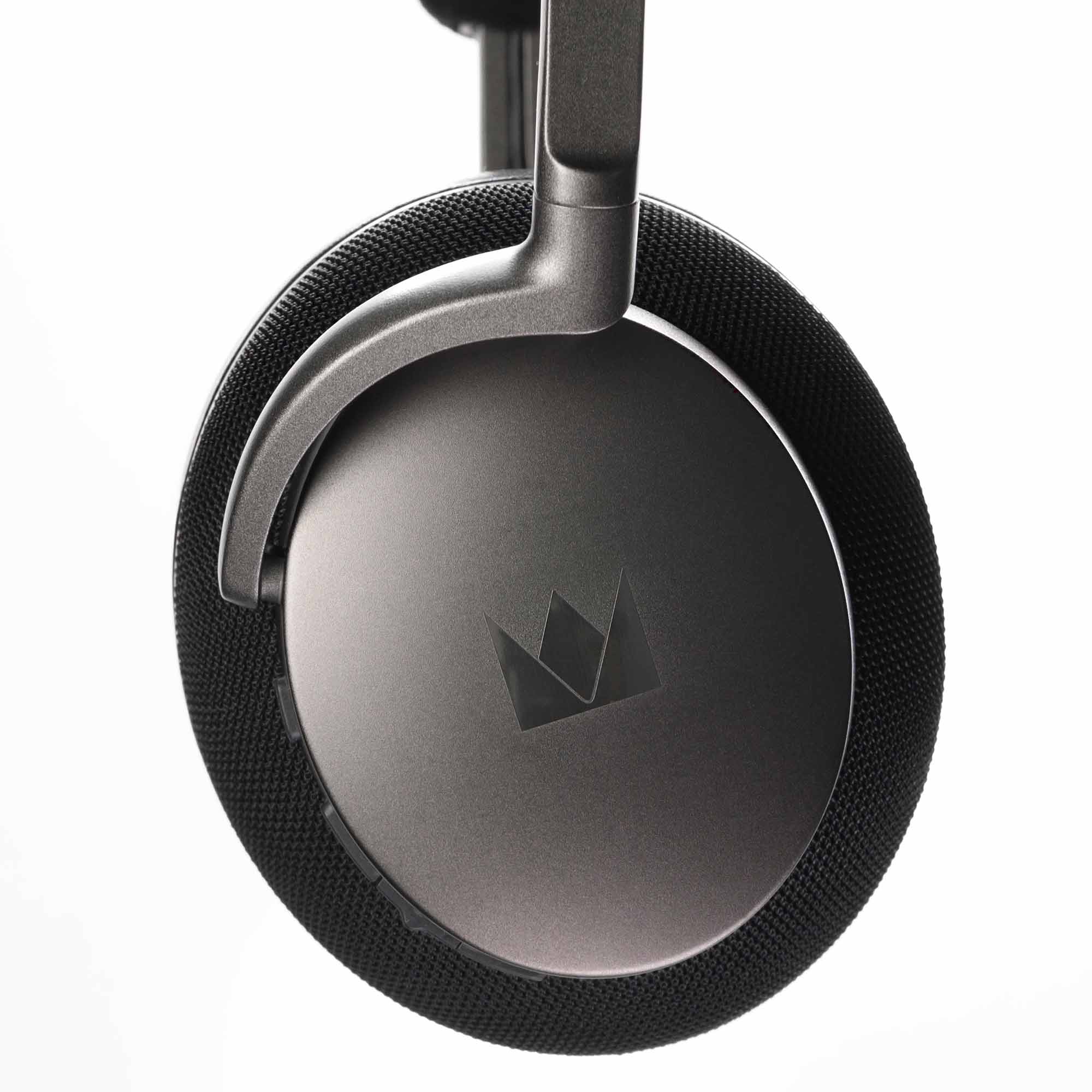 Close-up of the ear cup and headband of Noble Audio FoKus Apollo Wireless Headphones against a white background