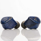 Noble Audio FoKus Prestige Wireless IEM with blue marbled finish and silver logo on white reflective background