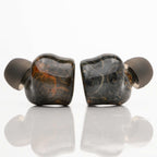 Noble Audio FoKus Prestige Wireless IEM with black and brown marbled design and silicone ear tips on white background