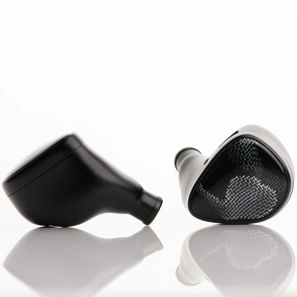 Noble Audio Onyx Universal Fit In-Ear Monitors in black with mesh grille on a reflective white surface close-up view