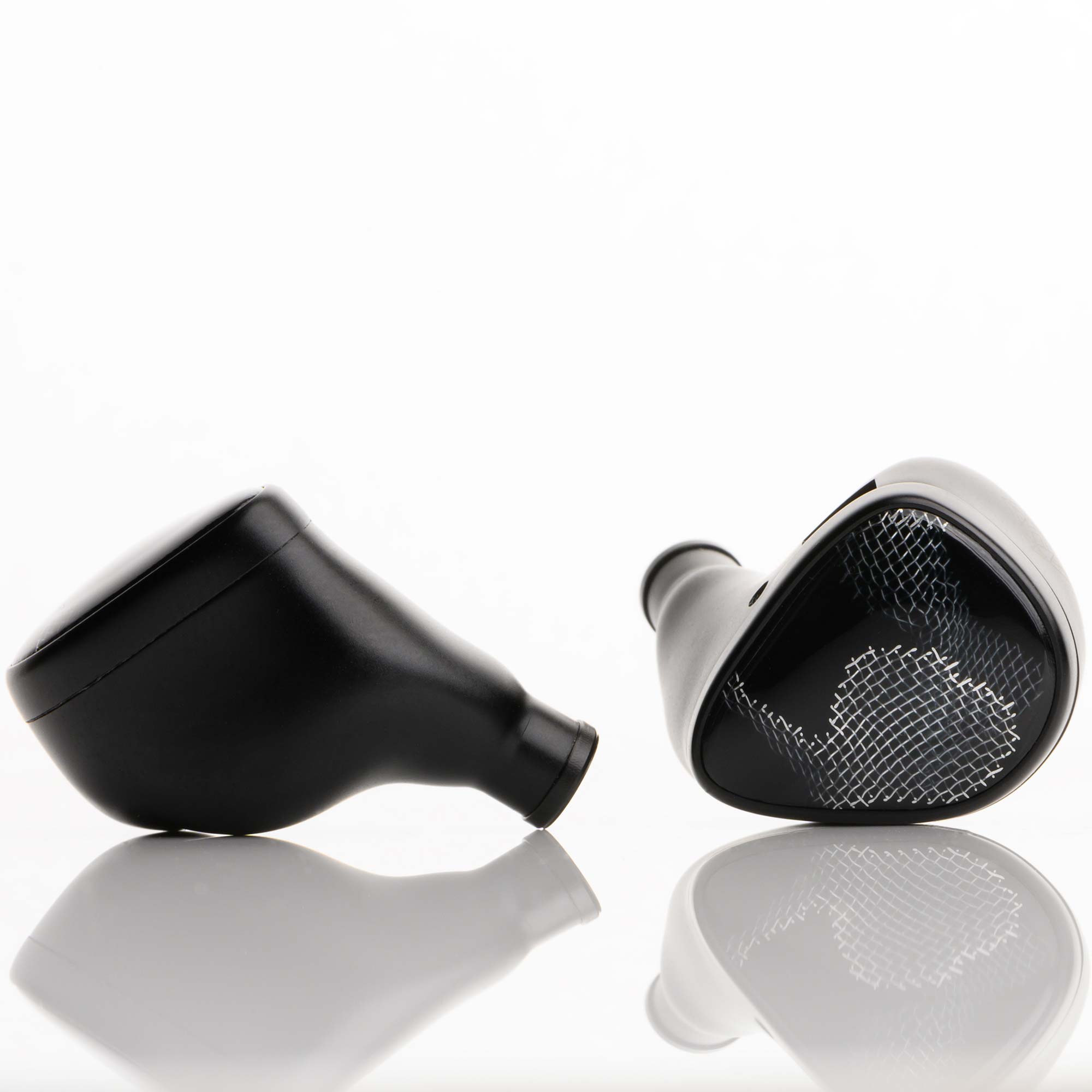 Noble Audio Onyx Universal Fit In-Ear Monitors in black with mesh grille on a reflective white surface close-up view