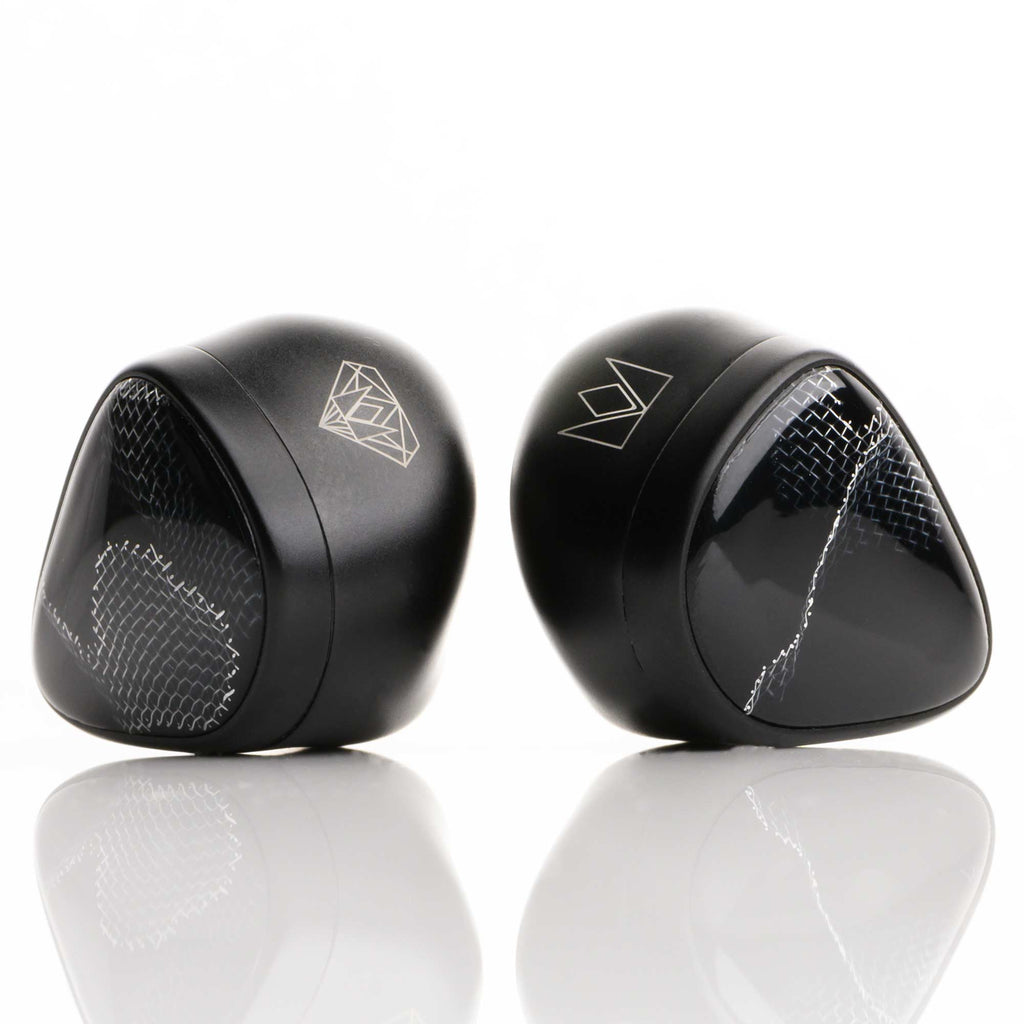 Noble Audio Onyx Universal Fit In-Ear Monitors with black glossy shells and silver geometric patterns on white background