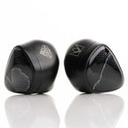 Noble Audio Onyx Universal Fit In-Ear Monitors with black glossy shells and silver geometric patterns on white background