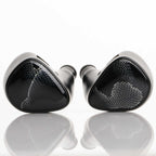 Noble Audio Onyx Universal Fit In-Ear Monitors with glossy black finish and subtle mesh detail on reflective surface